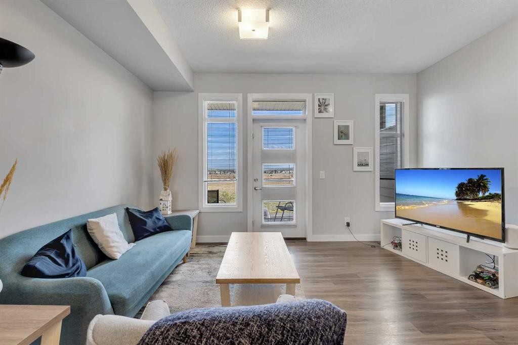 154 Seton Passage Se, Calgary, AB - Indoor Photo Showing Living Room