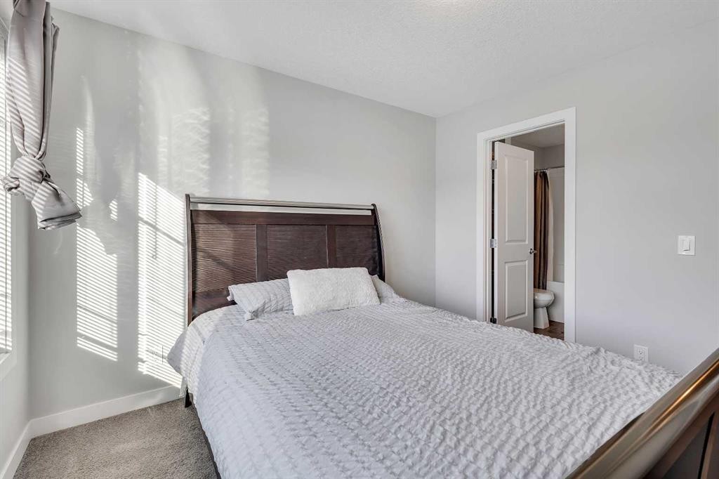 154 Seton Passage Se, Calgary, AB - Indoor Photo Showing Bedroom