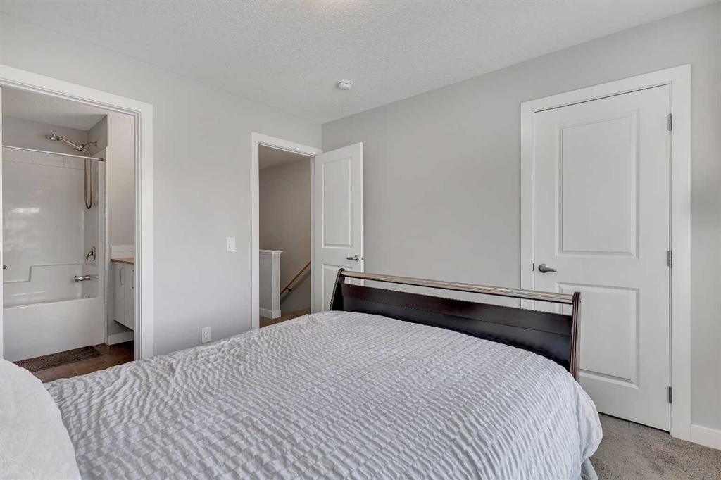 154 Seton Passage Se, Calgary, AB - Indoor Photo Showing Bedroom