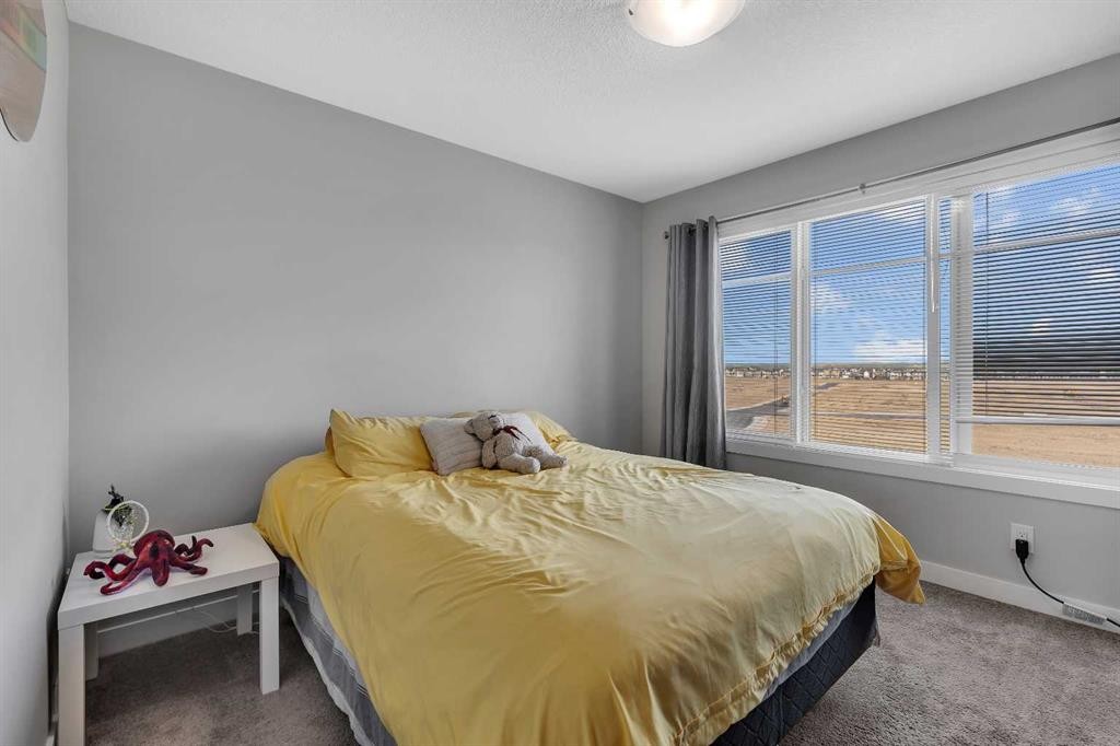 154 Seton Passage Se, Calgary, AB - Indoor Photo Showing Bedroom