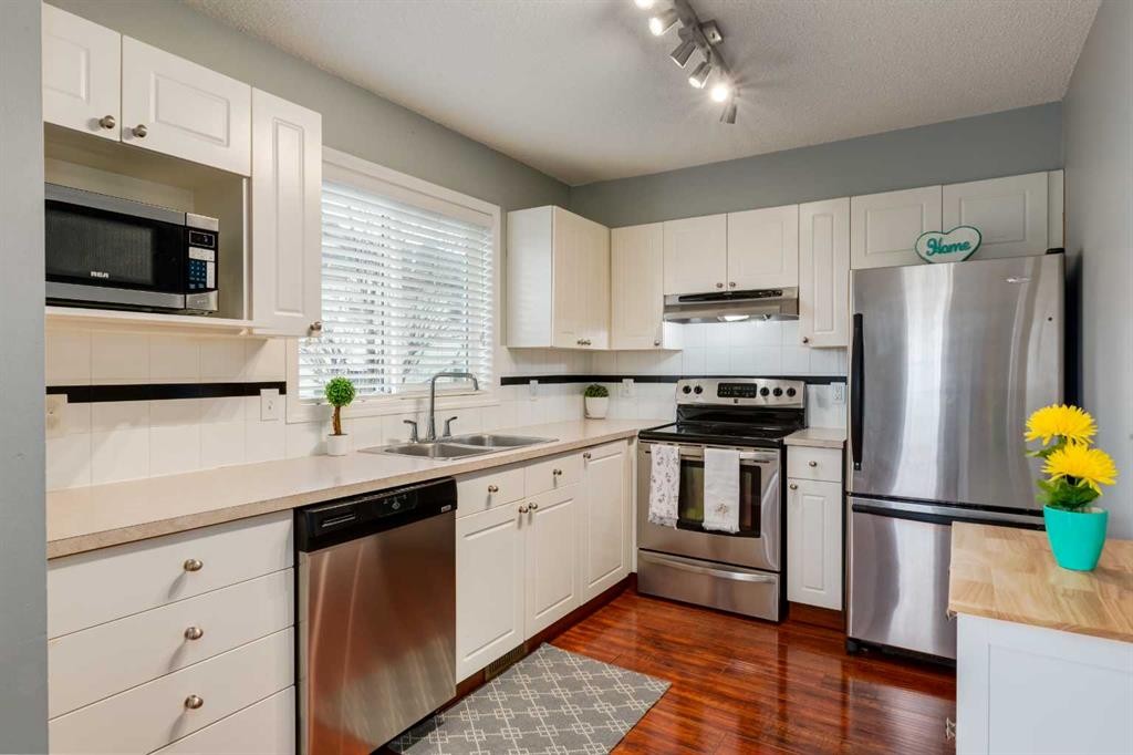 126 Harvest Gold Place Ne, Calgary, AB - Indoor Photo Showing Kitchen With Stainless Steel Kitchen With Double Sink