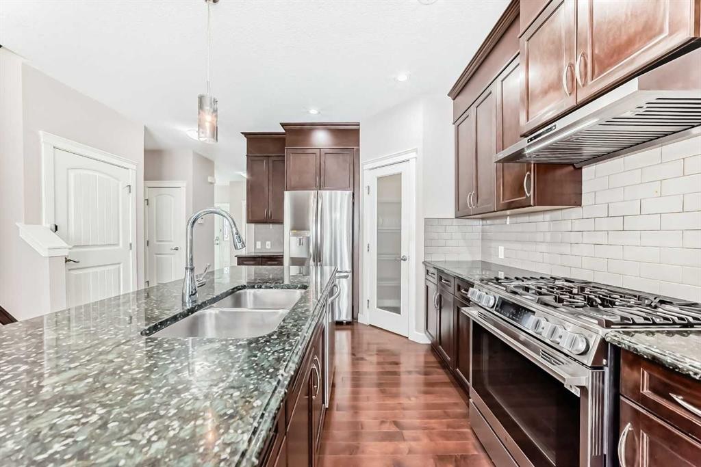 101 Redstone Drive Ne, Calgary, AB - Indoor Photo Showing Kitchen With Stainless Steel Kitchen With Double Sink With Upgraded Kitchen