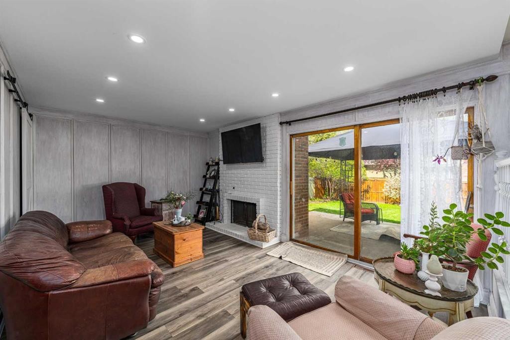 51 Midvalley Crescent Se, Calgary, AB - Indoor Photo Showing Living Room With Fireplace