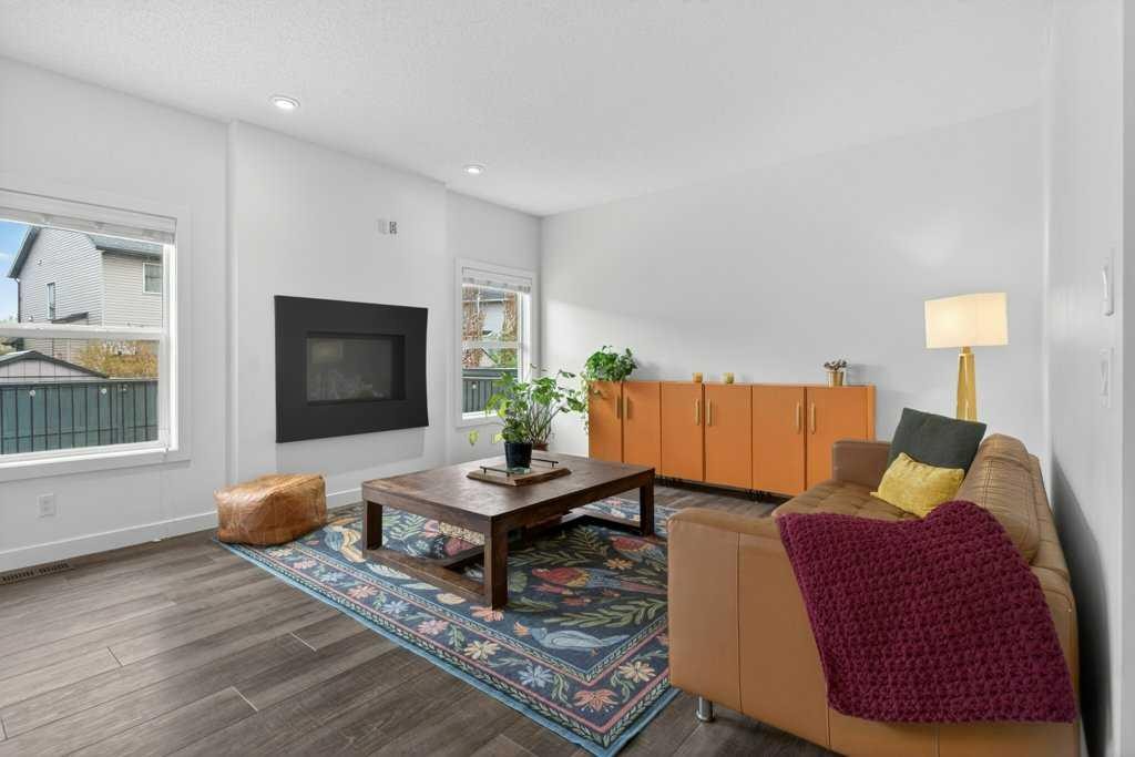 1091 Brightoncrest Green Se, Calgary, AB - Indoor Photo Showing Living Room With Fireplace