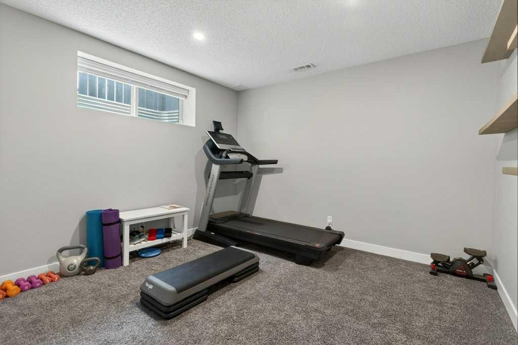 1091 Brightoncrest Green Se, Calgary, AB - Indoor Photo Showing Gym Room
