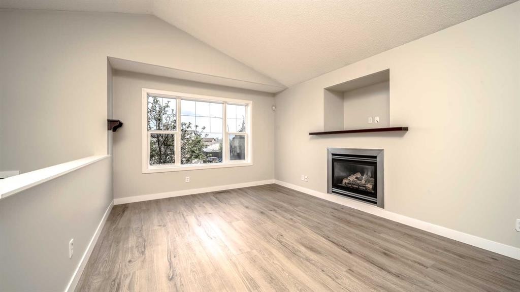 367 Copperfield Heights Se, Calgary, AB - Indoor Photo Showing Living Room With Fireplace