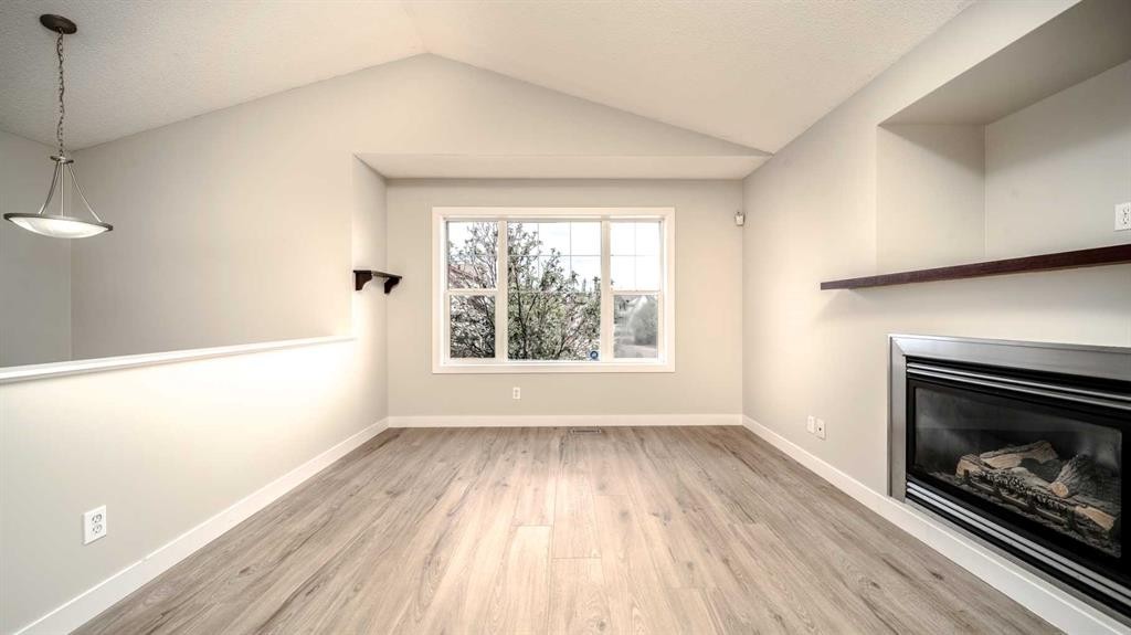 367 Copperfield Heights Se, Calgary, AB - Indoor Photo Showing Living Room With Fireplace