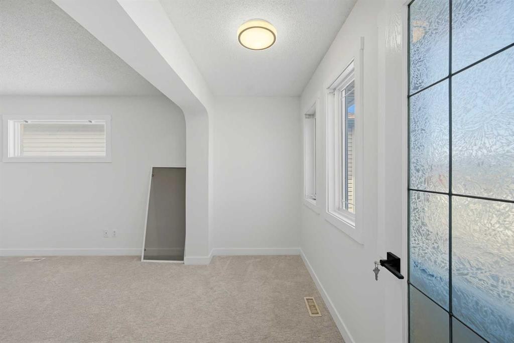 88 Saddletree Close Ne, Calgary, AB - Indoor Photo Showing Other Room