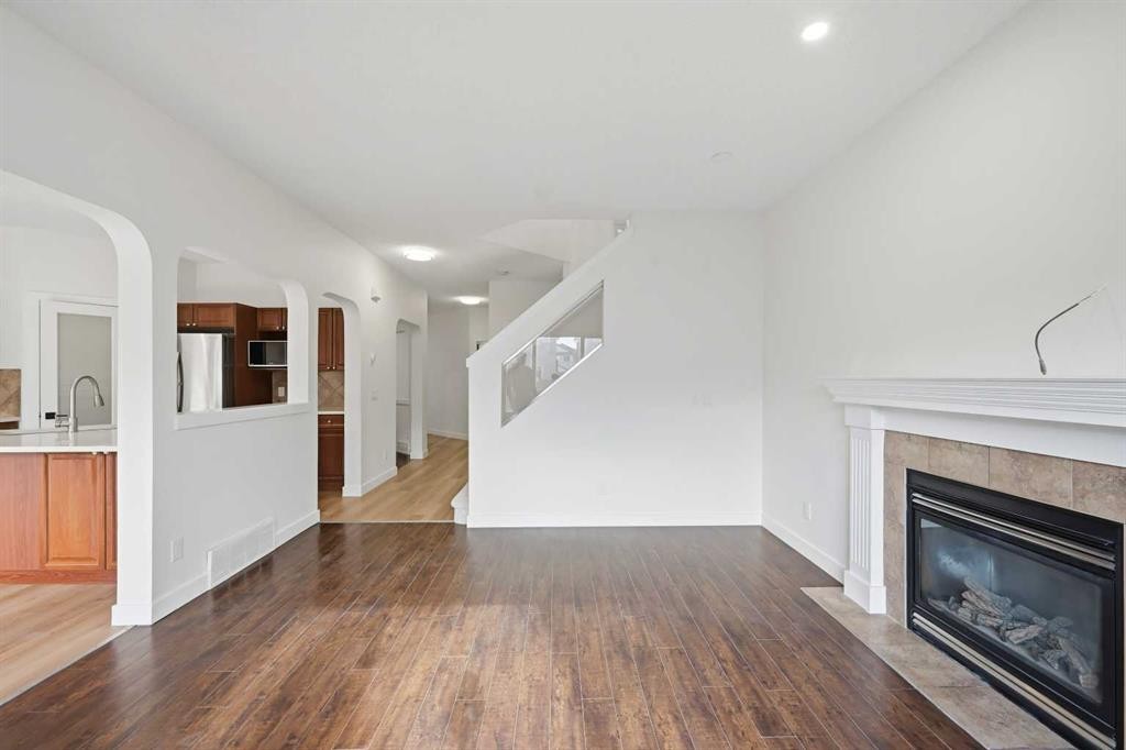 88 Saddletree Close Ne, Calgary, AB - Indoor Photo Showing Living Room With Fireplace