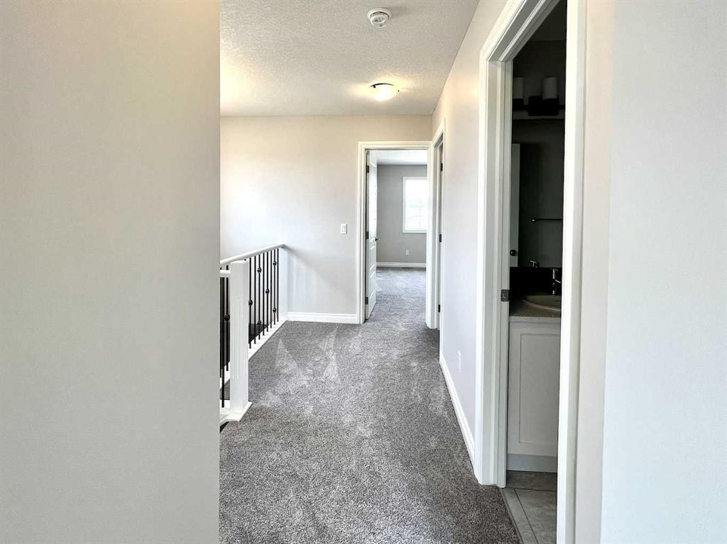 30 Emberside Link, Cochrane, AB - Indoor Photo Showing Other Room