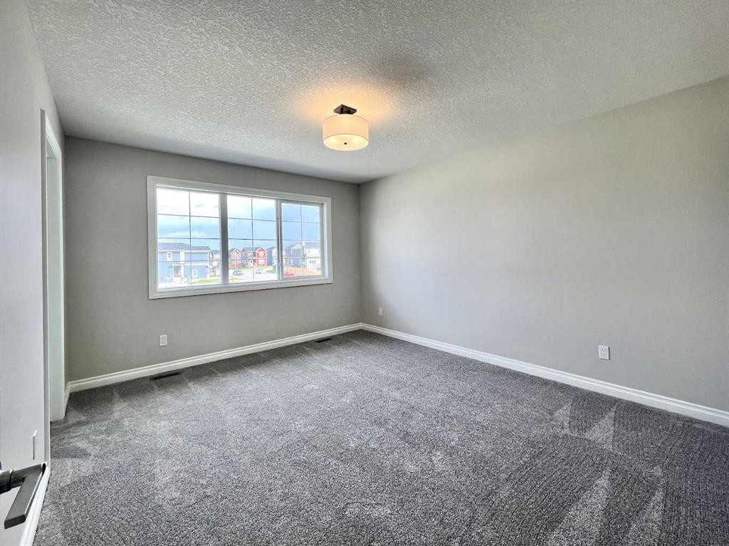 30 Emberside Link, Cochrane, AB - Indoor Photo Showing Other Room
