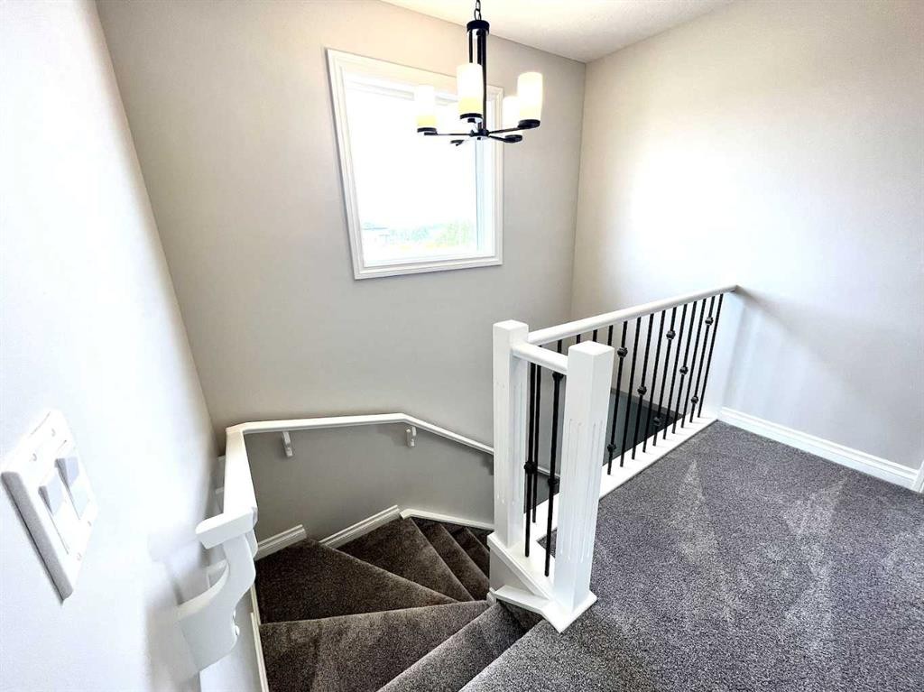 30 Emberside Link, Cochrane, AB - Indoor Photo Showing Other Room