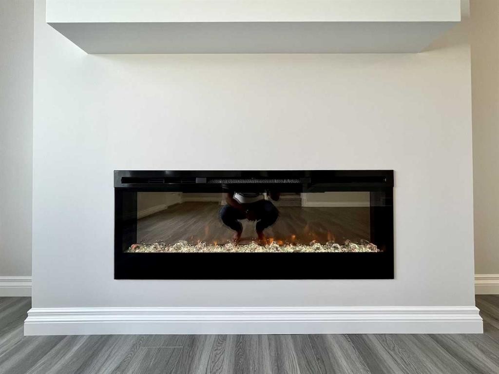 30 Emberside Link, Cochrane, AB - Indoor With Fireplace