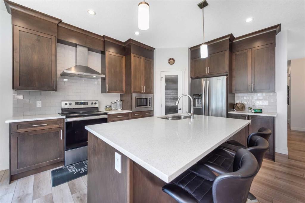 32 Saddlestone Way Ne, Calgary, AB - Indoor Photo Showing Kitchen With Upgraded Kitchen