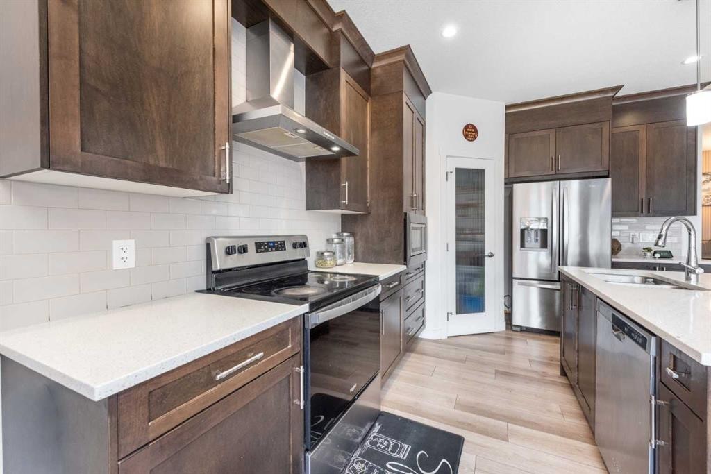 32 Saddlestone Way Ne, Calgary, AB - Indoor Photo Showing Kitchen With Upgraded Kitchen