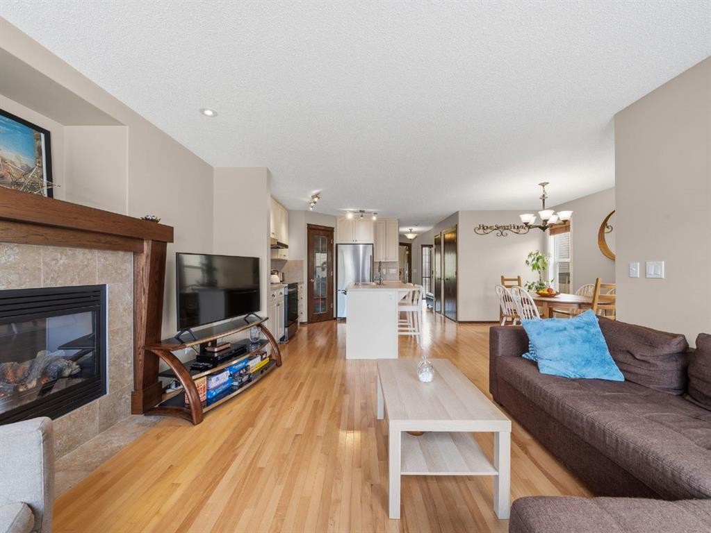 28 Cranberry Lane Se, Calgary, AB - Indoor Photo Showing Living Room With Fireplace
