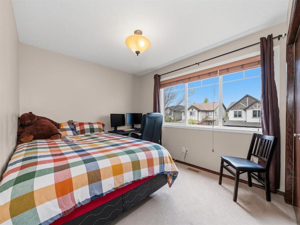 28 Cranberry Lane Se, Calgary, AB - Indoor Photo Showing Bedroom