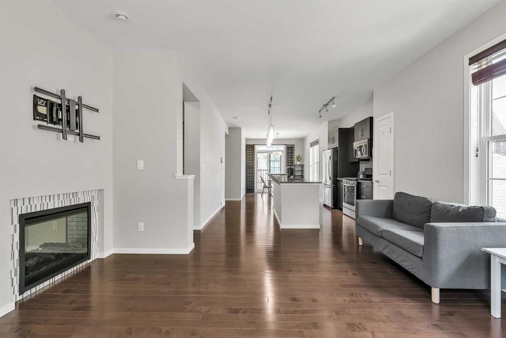 439 Ascot Circle Sw, Calgary, AB - Indoor Photo Showing Living Room With Fireplace