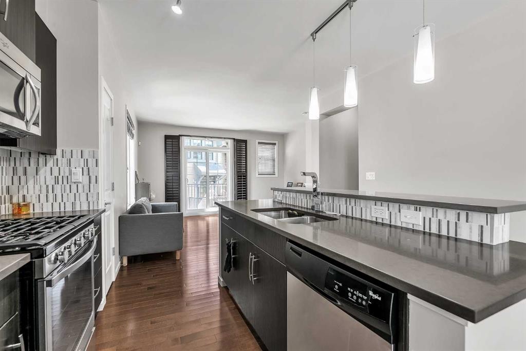 439 Ascot Circle Sw, Calgary, AB - Indoor Photo Showing Kitchen With Stainless Steel Kitchen With Double Sink With Upgraded Kitchen