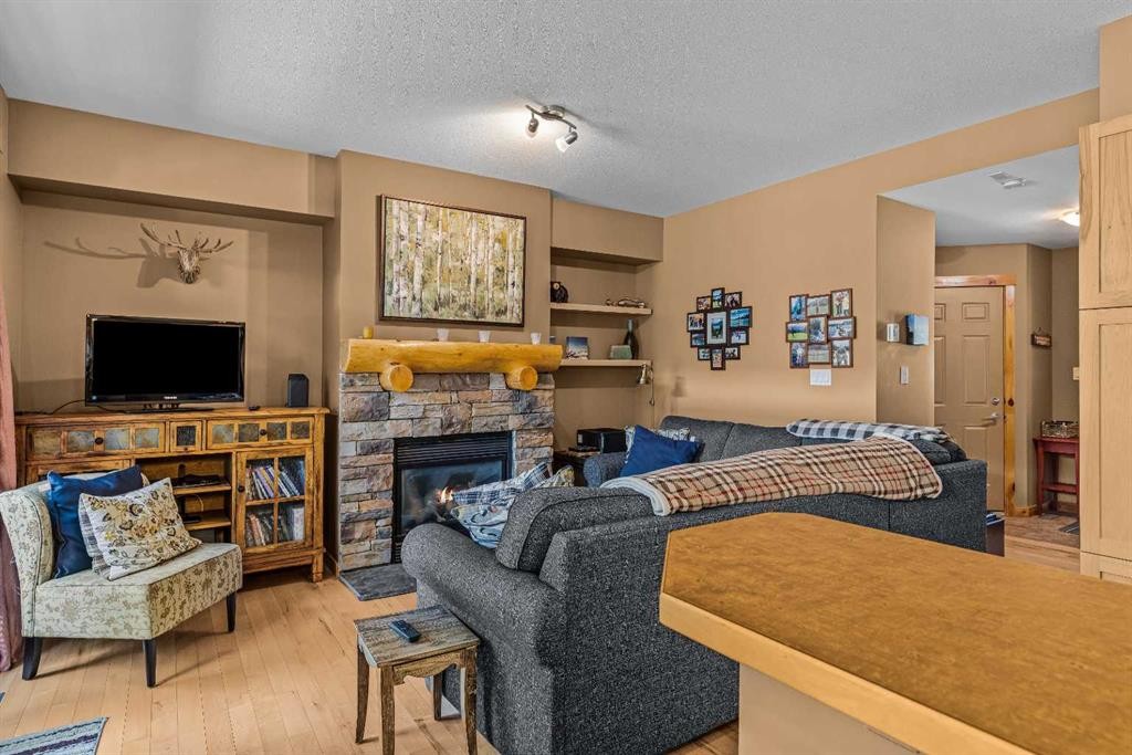 1003-70 Dyrgas Gate, Canmore, AB - Indoor Photo Showing Living Room With Fireplace