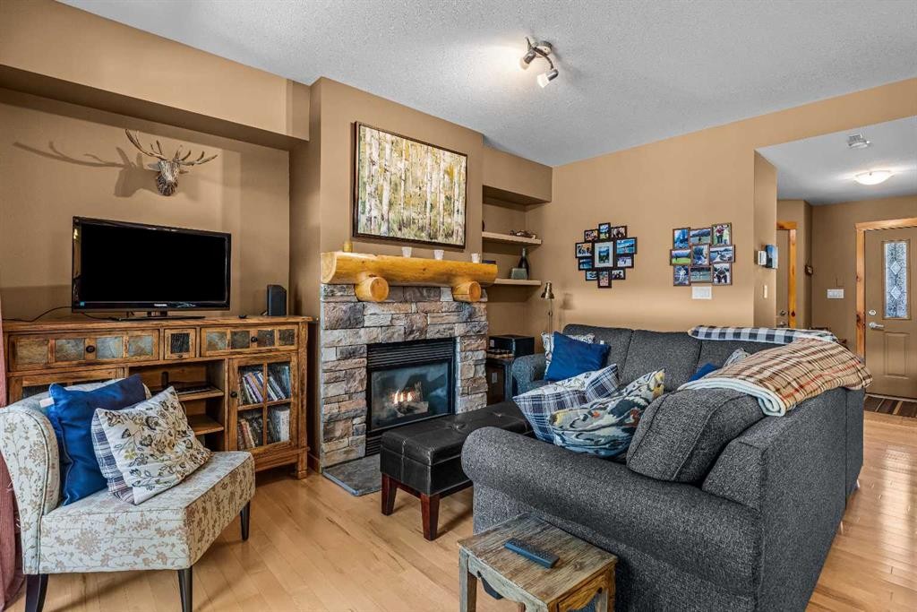 1003-70 Dyrgas Gate, Canmore, AB - Indoor Photo Showing Living Room With Fireplace