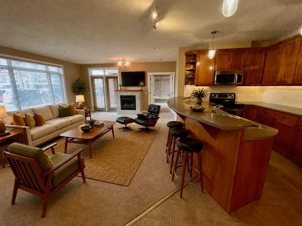 4107-24 Hemlock Crescent Sw, Calgary, AB - Indoor Photo Showing Other Room With Fireplace