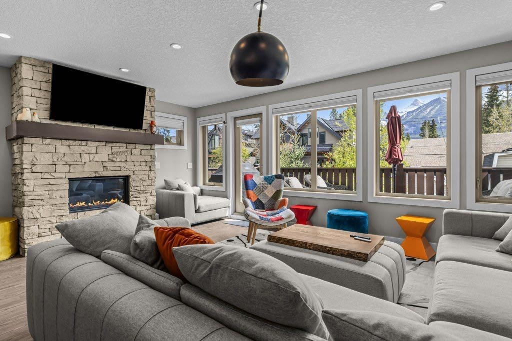 2-817 4Th Street, Canmore, AB - Indoor Photo Showing Living Room With Fireplace