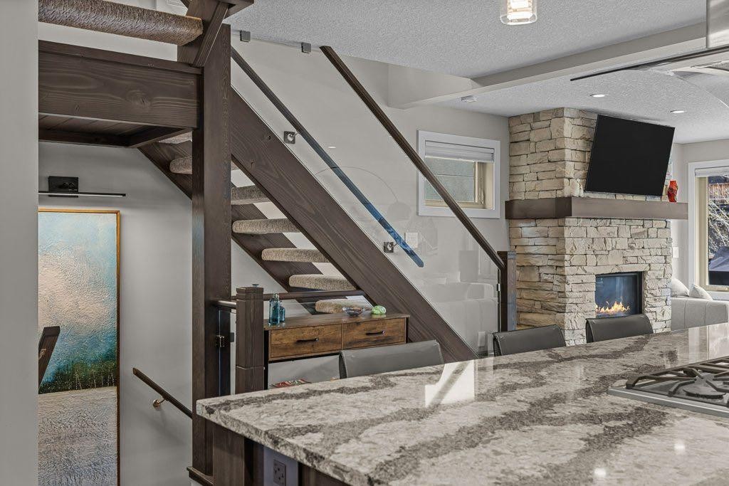 2-817 4Th Street, Canmore, AB - Indoor With Fireplace
