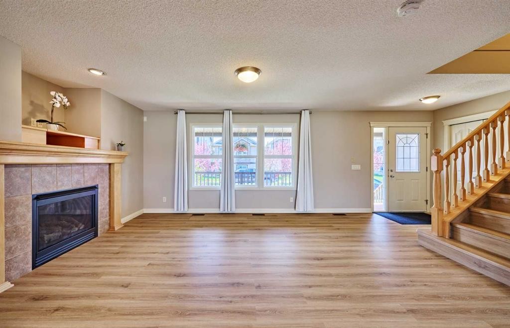 383 Prestwick Close Se, Calgary, AB - Indoor Photo Showing Living Room With Fireplace