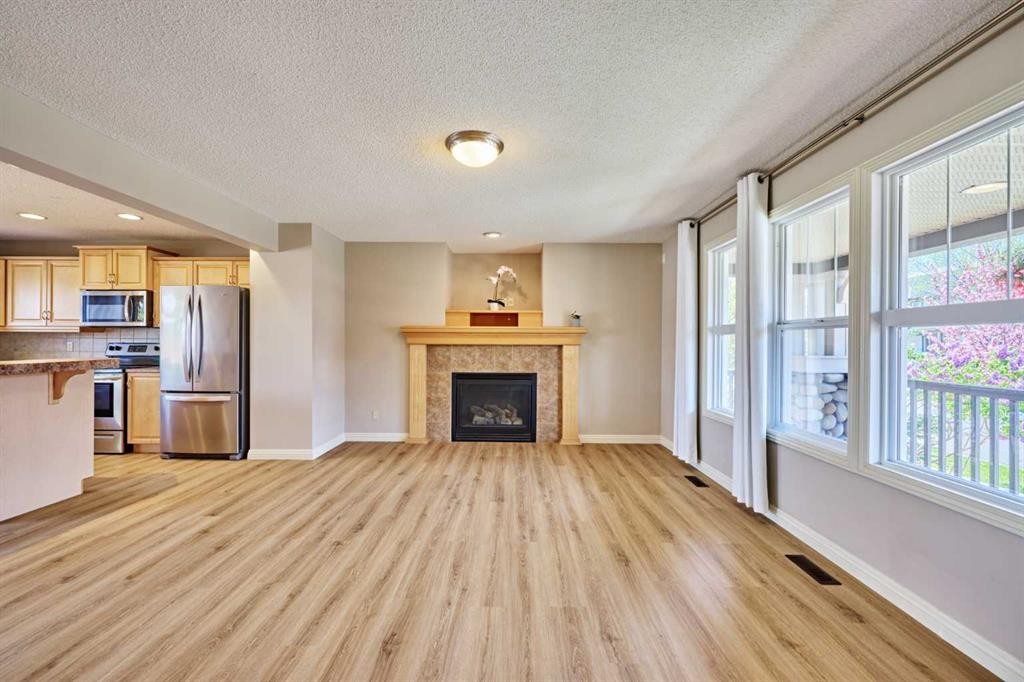 383 Prestwick Close Se, Calgary, AB - Indoor With Fireplace