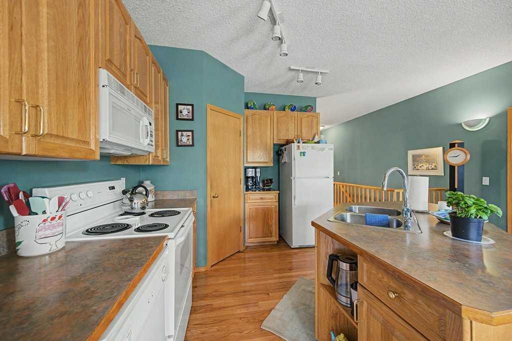 18 Prominence View Sw, Calgary, AB - Indoor Photo Showing Kitchen With Double Sink