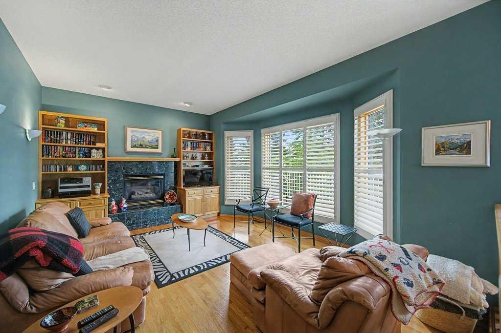18 Prominence View Sw, Calgary, AB - Indoor Photo Showing Living Room With Fireplace