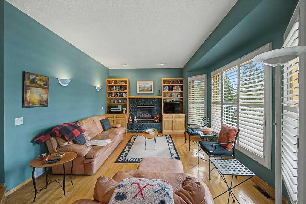 18 Prominence View Sw, Calgary, AB - Indoor Photo Showing Living Room With Fireplace