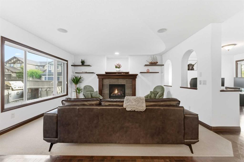 225 Panamount Road, Calgary, AB - Indoor Photo Showing Living Room With Fireplace