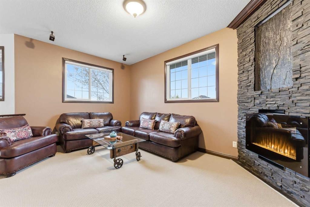 225 Panamount Road, Calgary, AB - Indoor Photo Showing Living Room With Fireplace