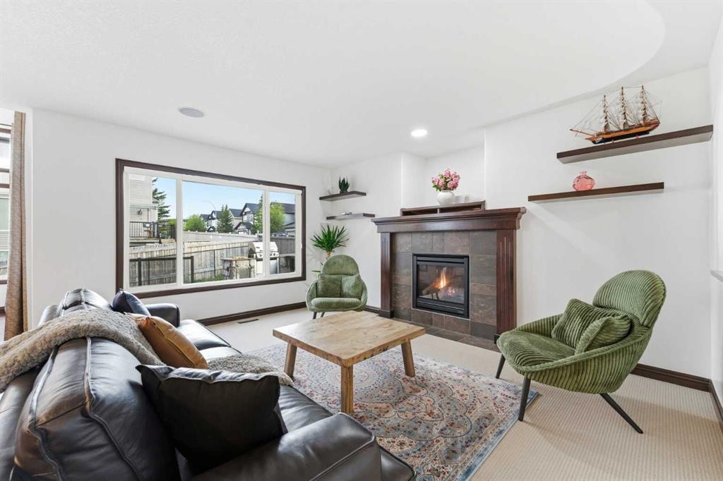225 Panamount Road, Calgary, AB - Indoor Photo Showing Living Room With Fireplace