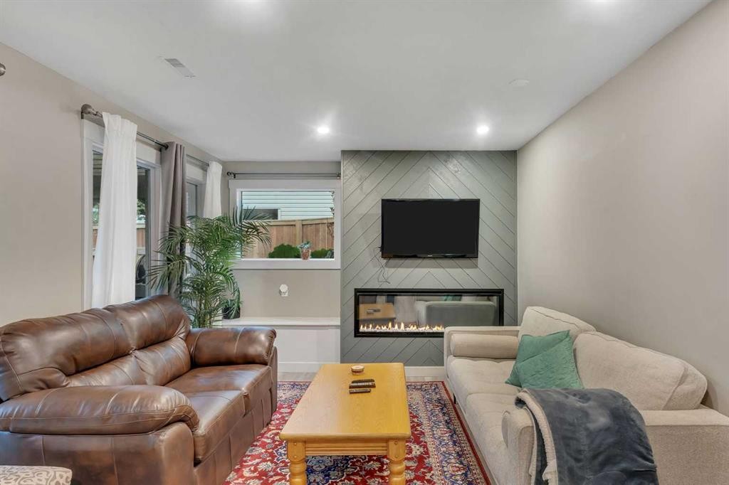 760 West Chestermere Drive, Chestermere, AB - Indoor Photo Showing Living Room With Fireplace