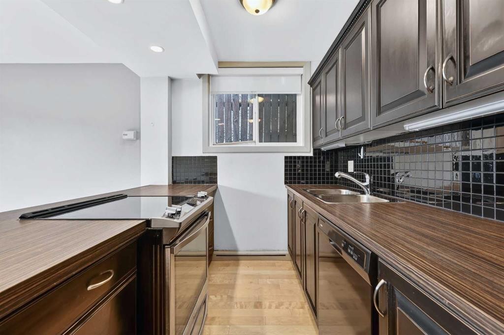 103-2020 11 Avenue Sw, Calgary, AB - Indoor Photo Showing Kitchen With Double Sink
