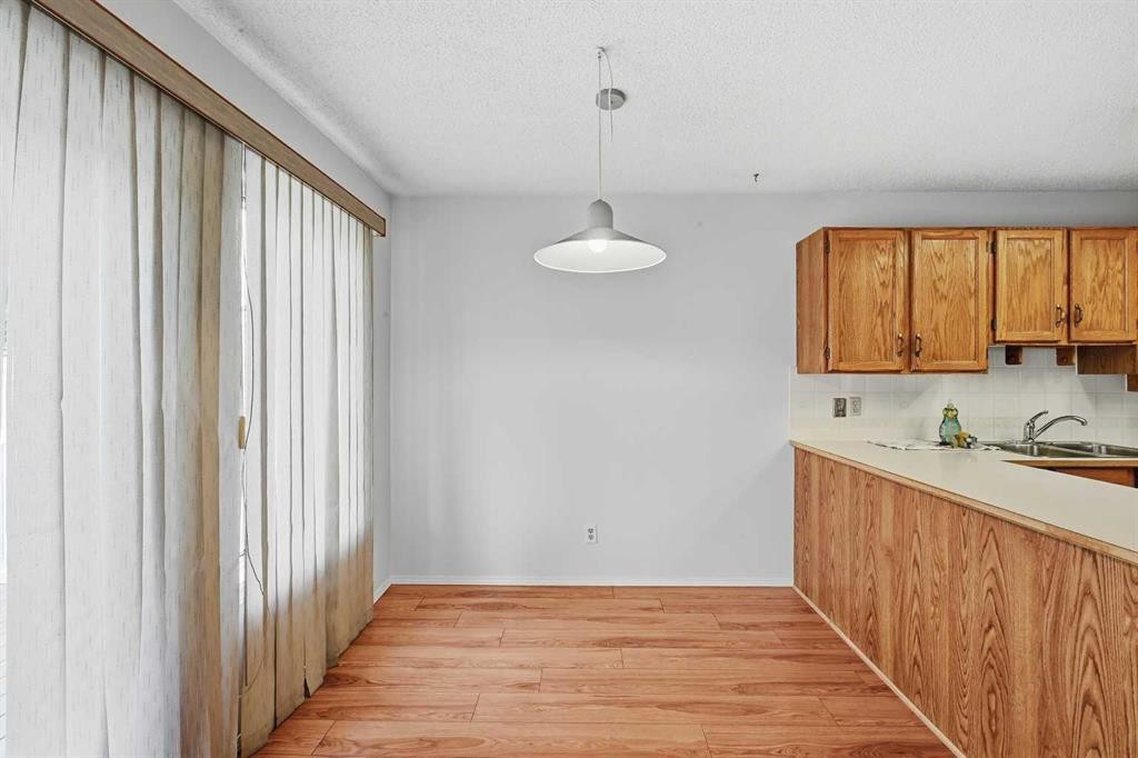 60 Rundlelawn Green Ne, Calgary, AB - Indoor Photo Showing Kitchen With Double Sink