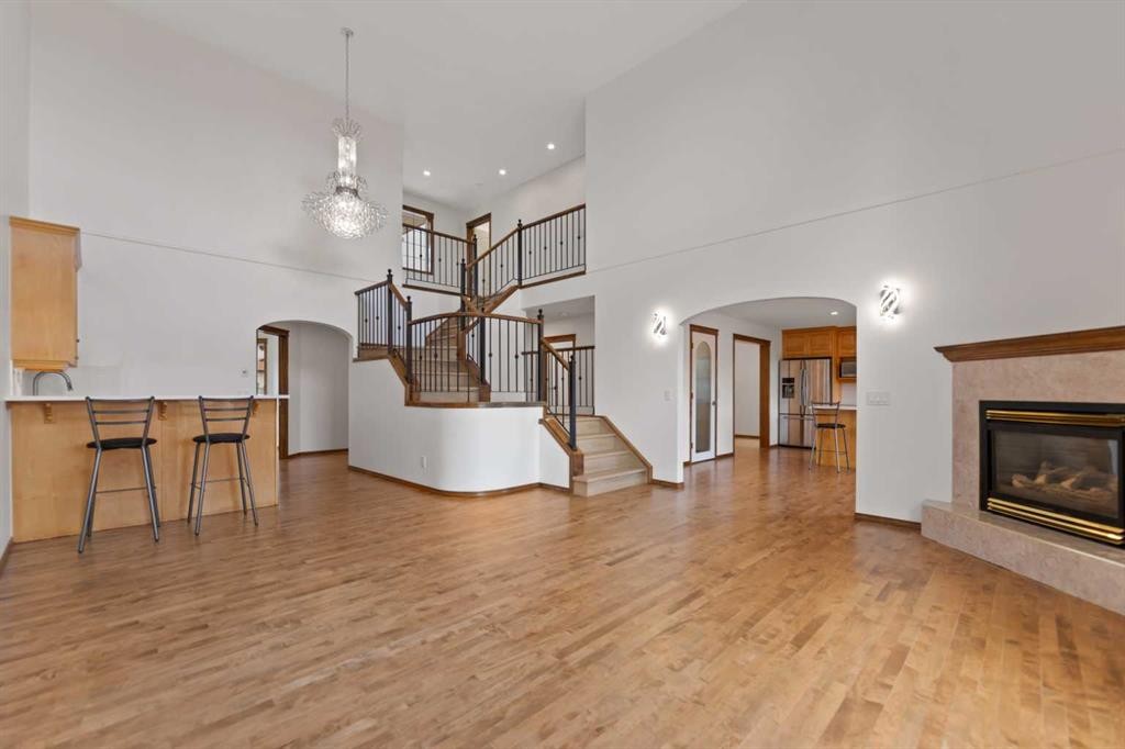 410 Long Beach Landing, Chestermere, AB - Indoor Photo Showing Living Room With Fireplace