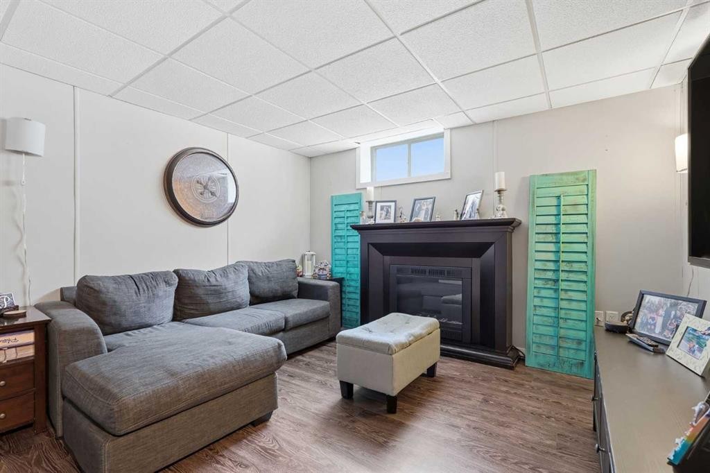 51 Aberdare Way Ne, Calgary, AB - Indoor Photo Showing Living Room With Fireplace