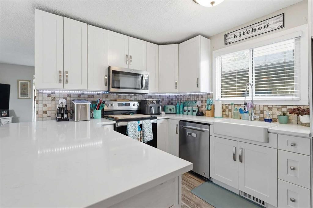 51 Aberdare Way Ne, Calgary, AB - Indoor Photo Showing Kitchen With Upgraded Kitchen