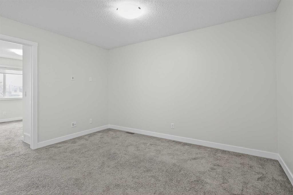 326 Creekside Boulevard Sw, Calgary, AB - Indoor Photo Showing Other Room