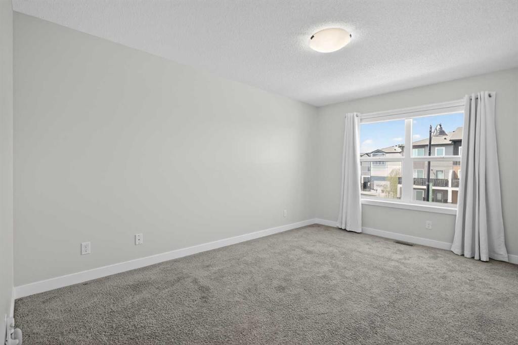 326 Creekside Boulevard Sw, Calgary, AB - Indoor Photo Showing Other Room