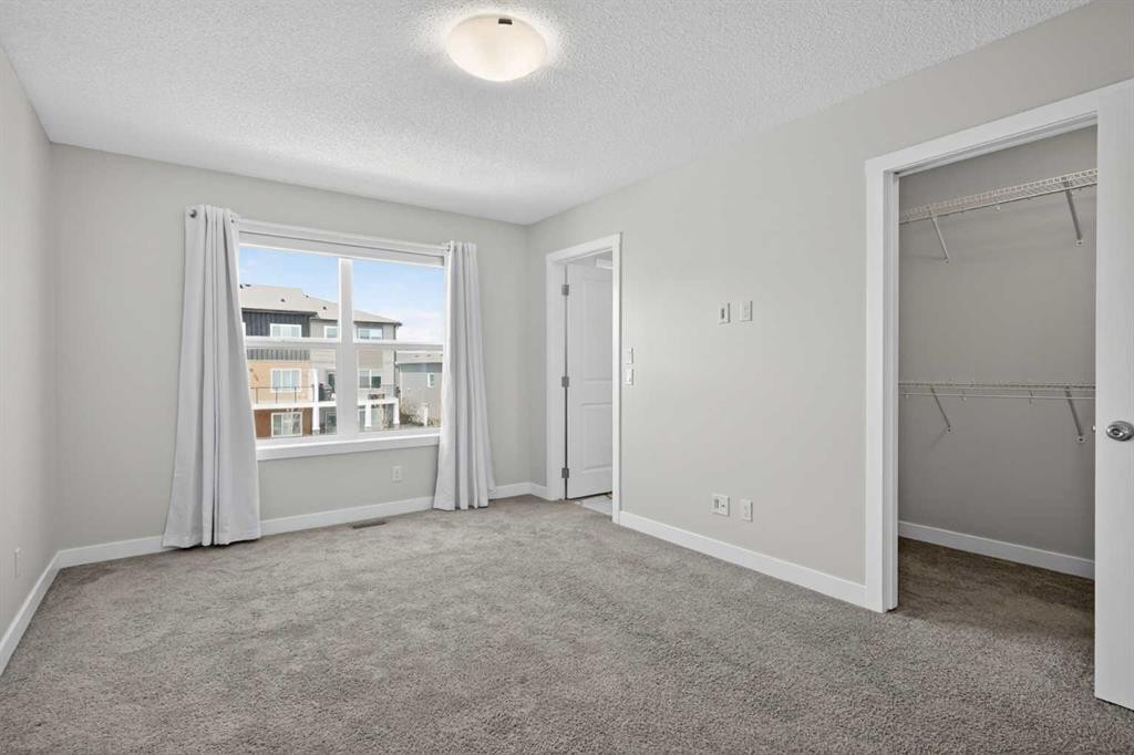 326 Creekside Boulevard Sw, Calgary, AB - Indoor Photo Showing Other Room