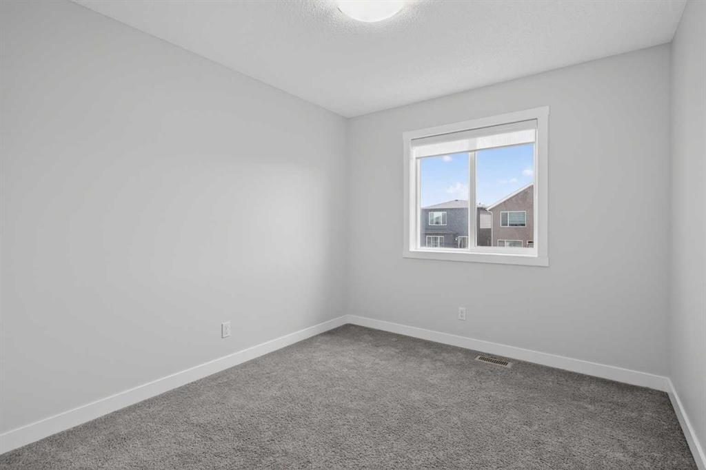 326 Creekside Boulevard Sw, Calgary, AB - Indoor Photo Showing Other Room