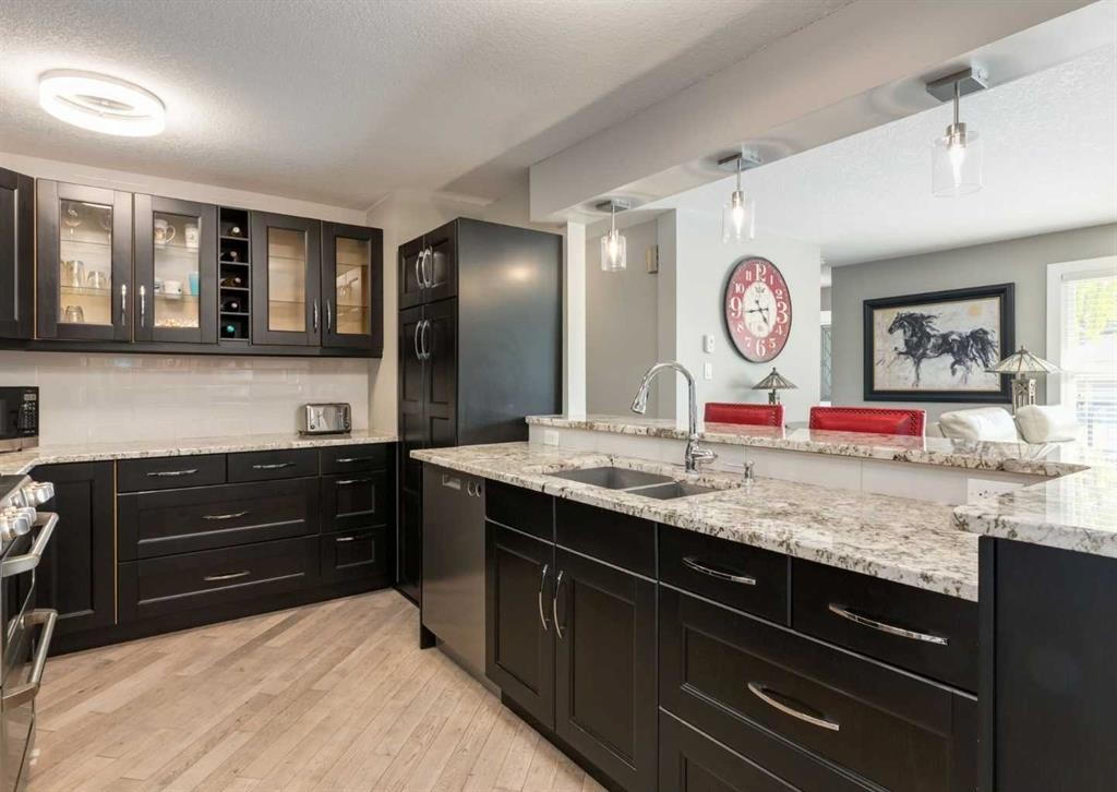 84 Fullerton Road Se, Calgary, AB - Indoor Photo Showing Kitchen With Double Sink