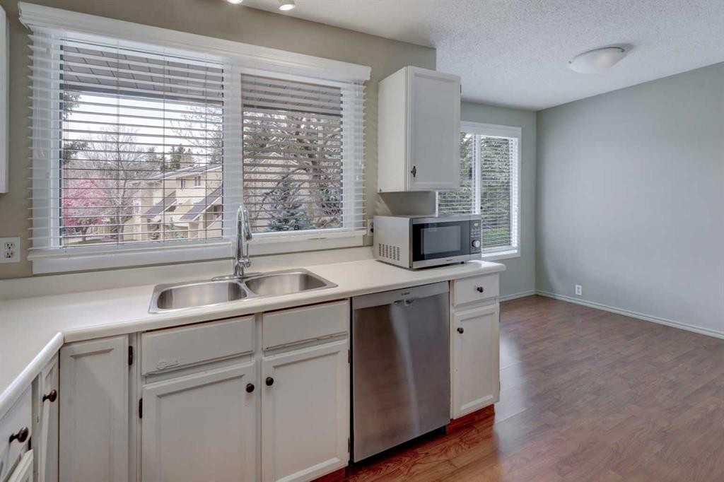 82 Point Drive Nw, Calgary, AB - Indoor Photo Showing Kitchen With Double Sink