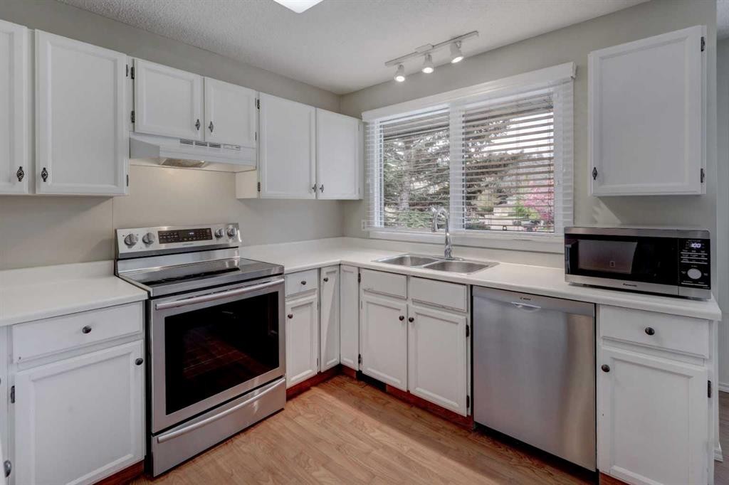 82 Point Drive Nw, Calgary, AB - Indoor Photo Showing Kitchen With Stainless Steel Kitchen With Double Sink