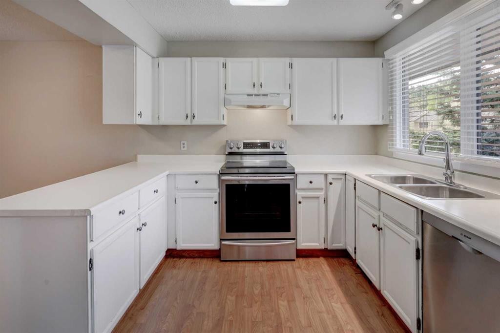 82 Point Drive Nw, Calgary, AB - Indoor Photo Showing Kitchen With Stainless Steel Kitchen With Double Sink